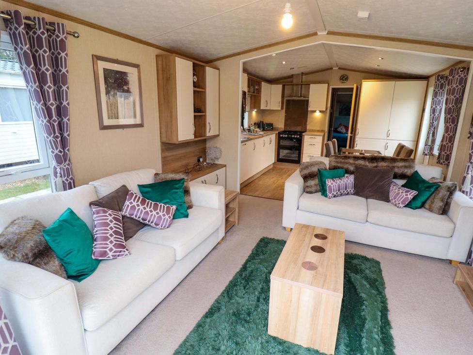 A living room with sofas and a coffee table at 108 Fox Burrow Hang in Great Yarmouth