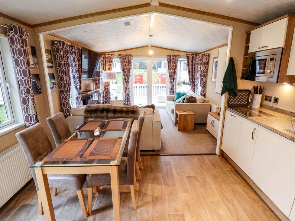 A living room with a dining area and kitchen at 108 Fox Burrow Hang Great Yarmouth