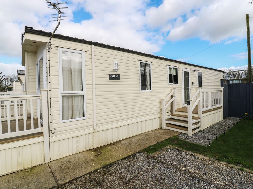 A caravan exterior with steps and railing at 2 bed Caravan in Stowmarket