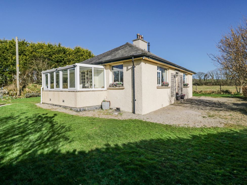 A house with a conservatory and garden at Linden Lea Grange-Over-Sands