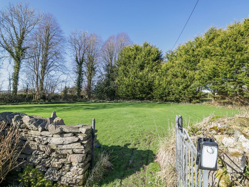 A garden with grass and trees at Linden Lea Grange-Over-Sands