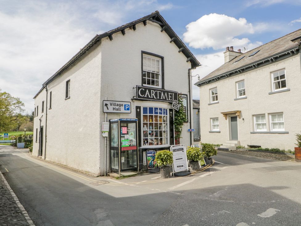 A corner building with signage at Cartmel in Grange-Over-Sands