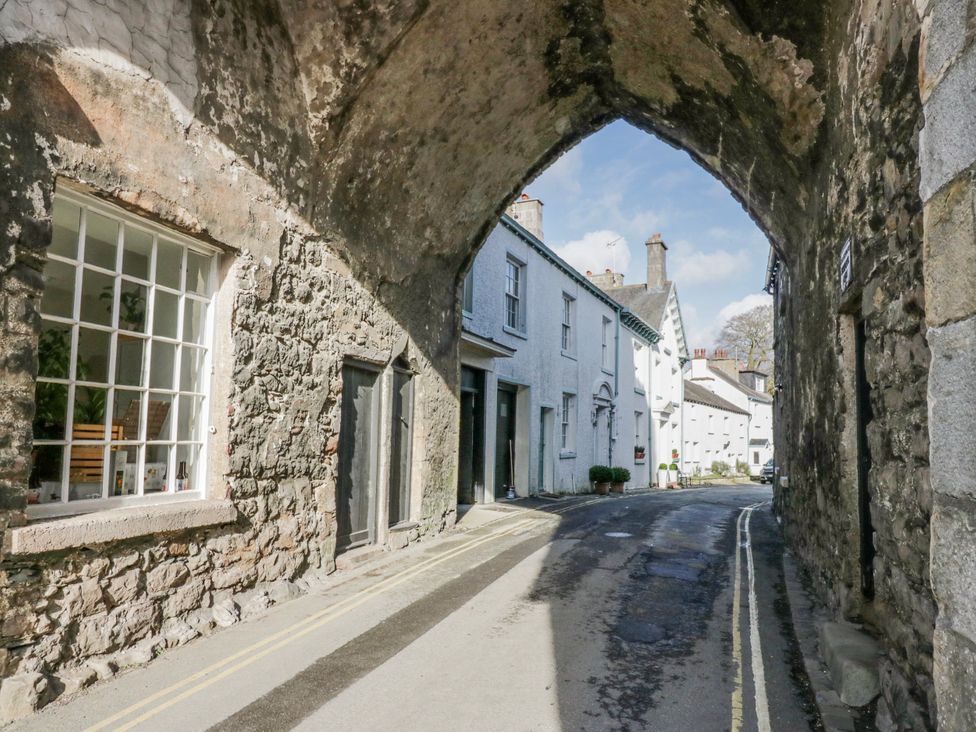 An archway with buildings and a road at Linden Lea in Grange-Over-Sands