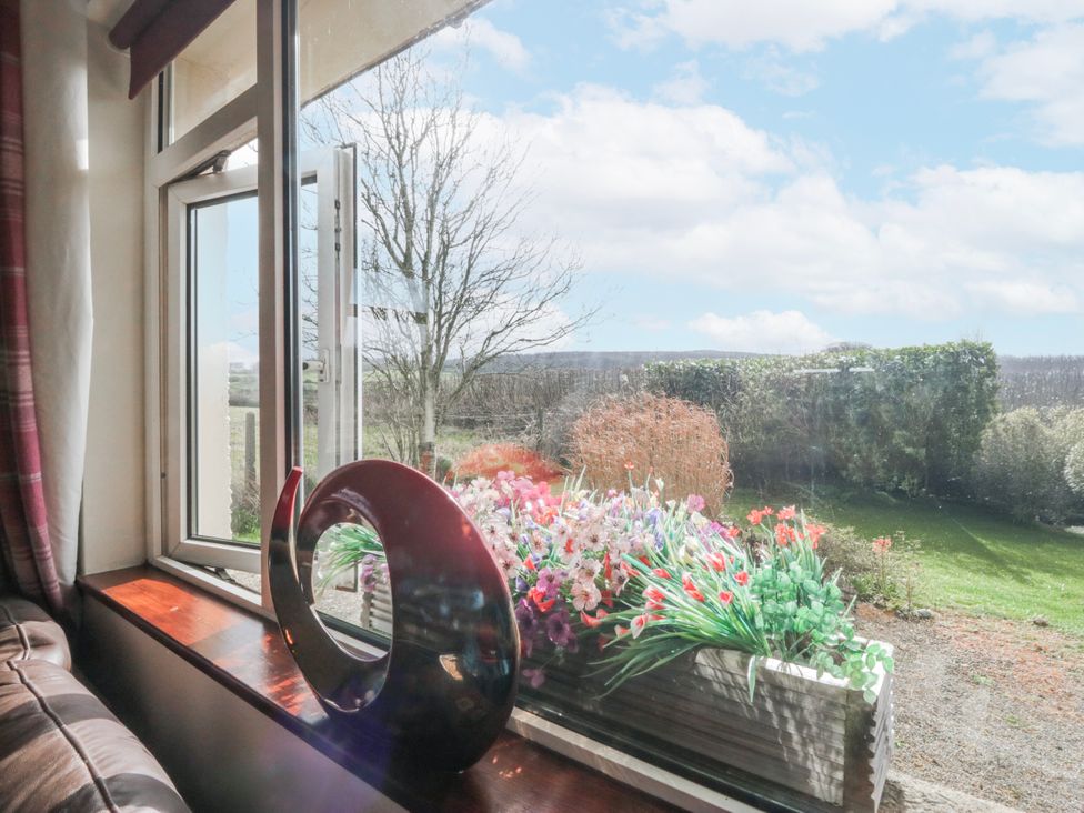 A living room window with flower planter at Linden Lea Field Broughton near Cartmel