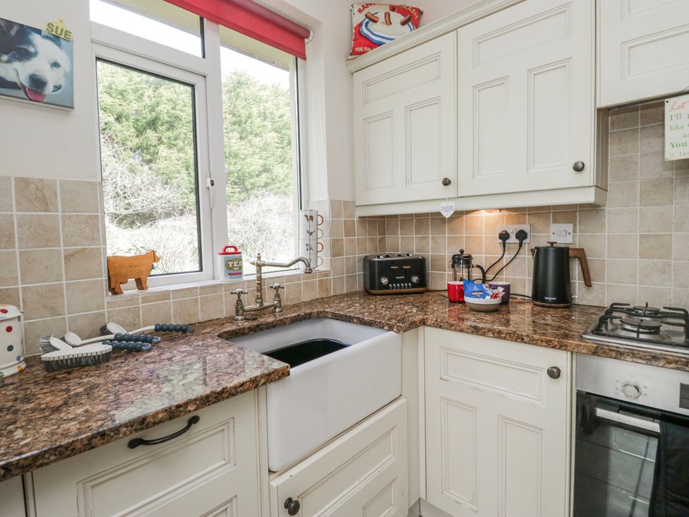 A kitchen with a sink and stove at Linden Lea Field Broughton near Cartmel