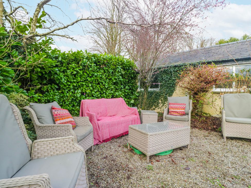 A garden with seating and a table at Linden Lea Field Broughton near Cartmel