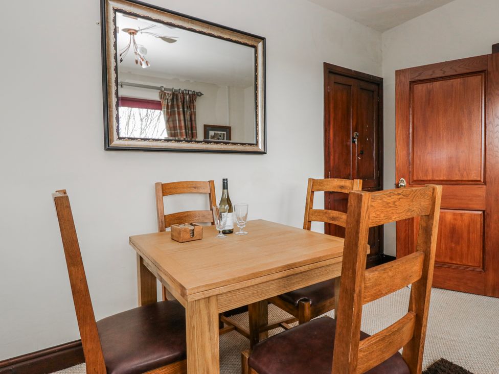 A dining room with a table and chairs at Linden Lea Field Broughton near Cartmel
