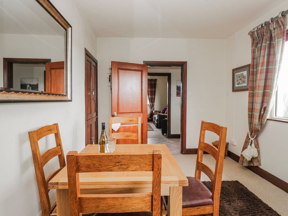 A dining room with a table and chairs at Linden Lea Field Broughton near Cartmel