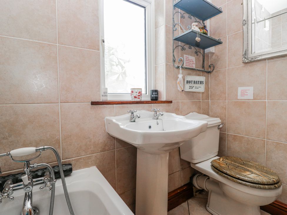 A bathroom with a sink toilet and bathtub at Linden Lea Field Broughton near Cartmel