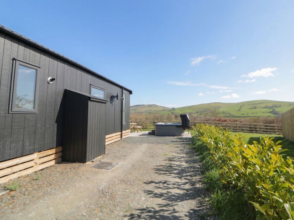 An outdoor area with a hot tub at Daverneithon 3 near Llandrindod Wells