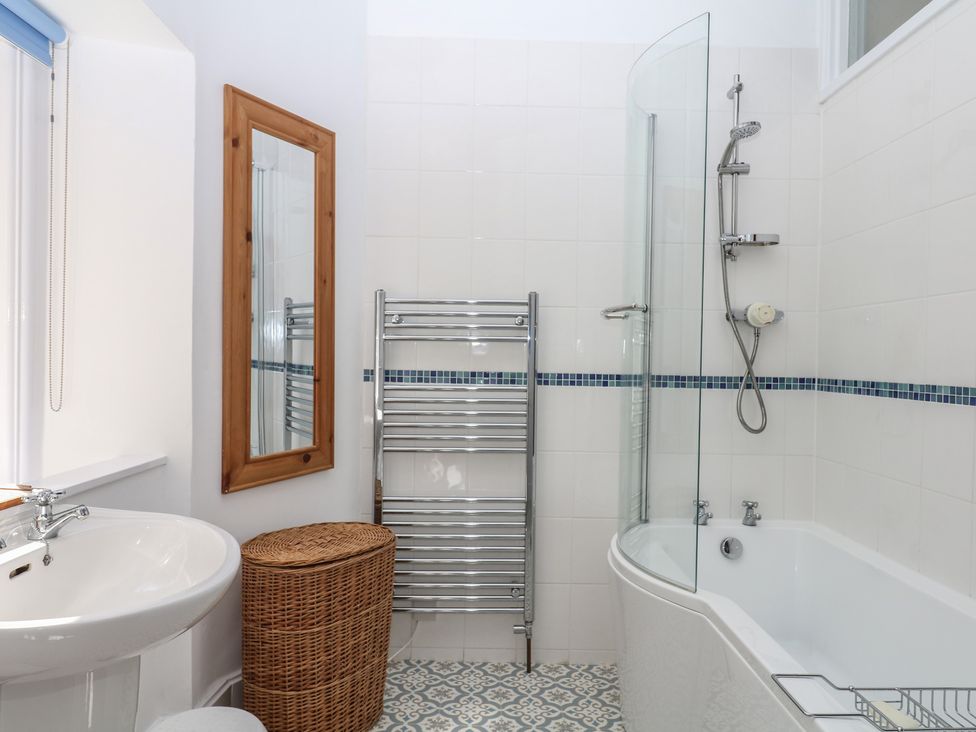 A bathroom featuring a sink, bathtub, and shower at Lukesland Wing Ivybridge