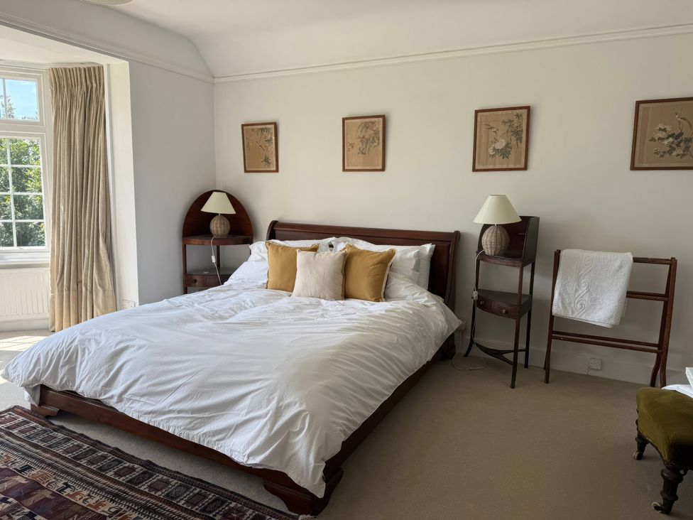 A bedroom with a bed and nightstand at Avenue Road in Lymington