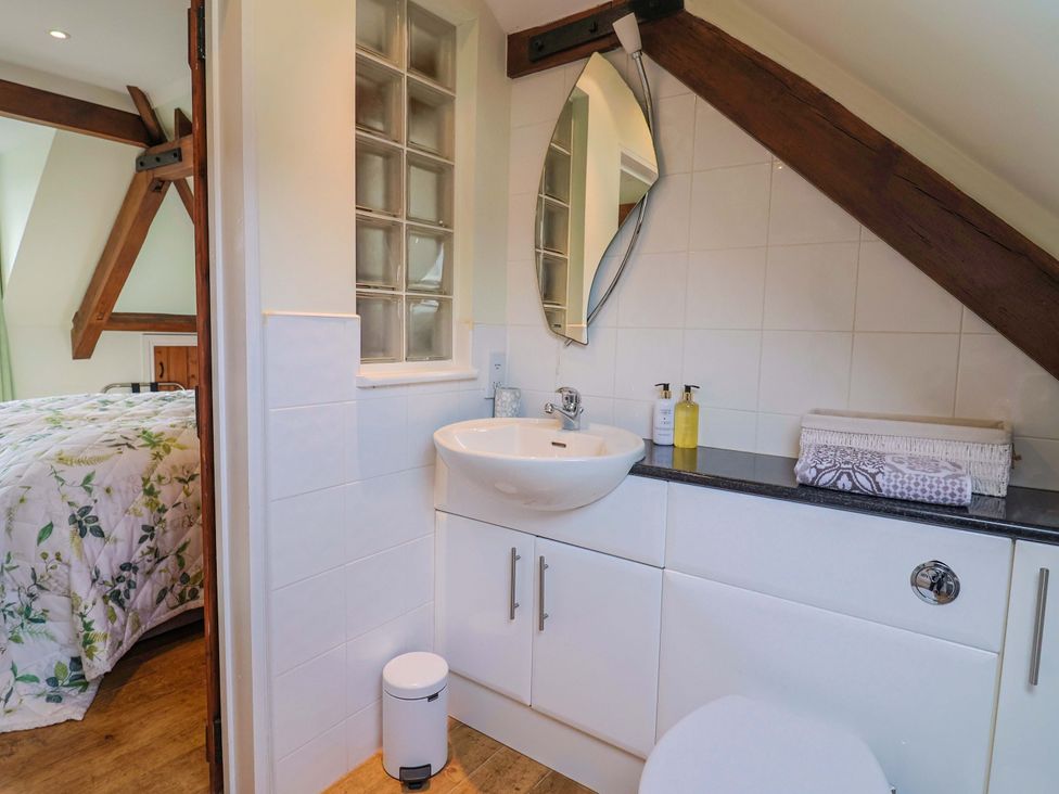 A bathroom with a sink and toilet at The Coach House in Dorchester
