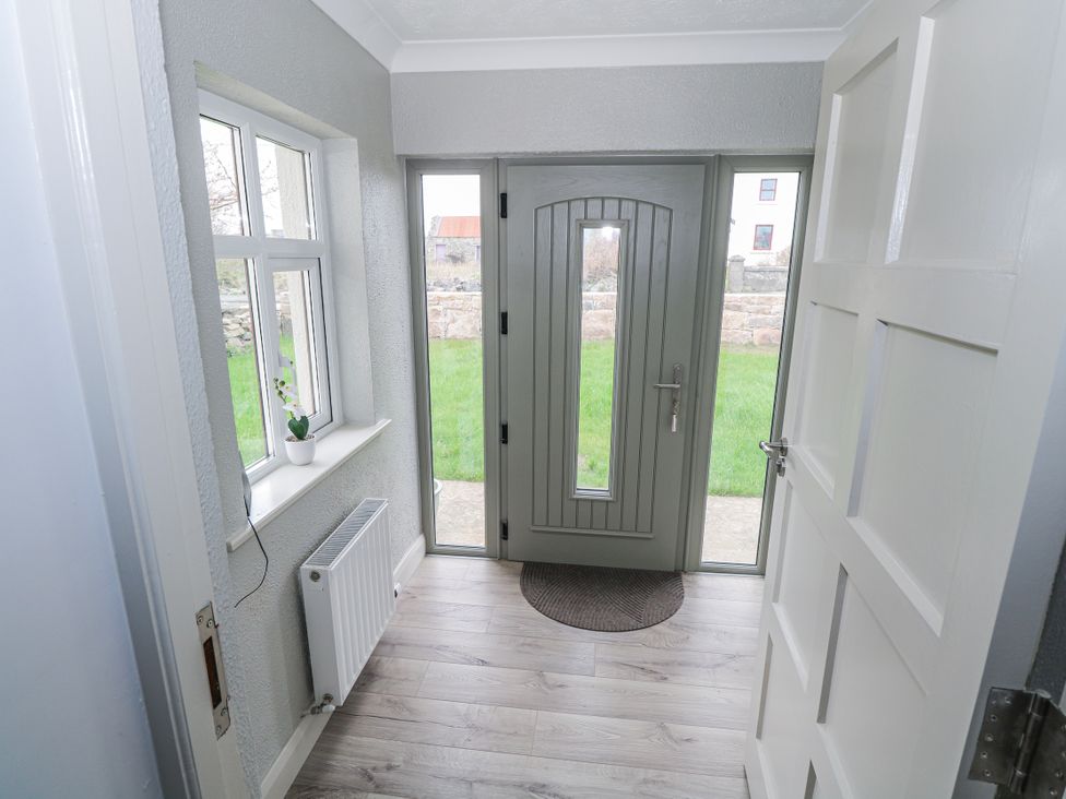 An entrance with a front door and windows at Ballina in Inverin