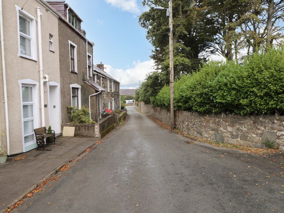 A street view with houses along a road at Ty Pen in Nefyn