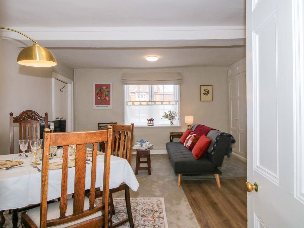 A dining room with a table and chairs at The Apartment at the Grey House Albrighton