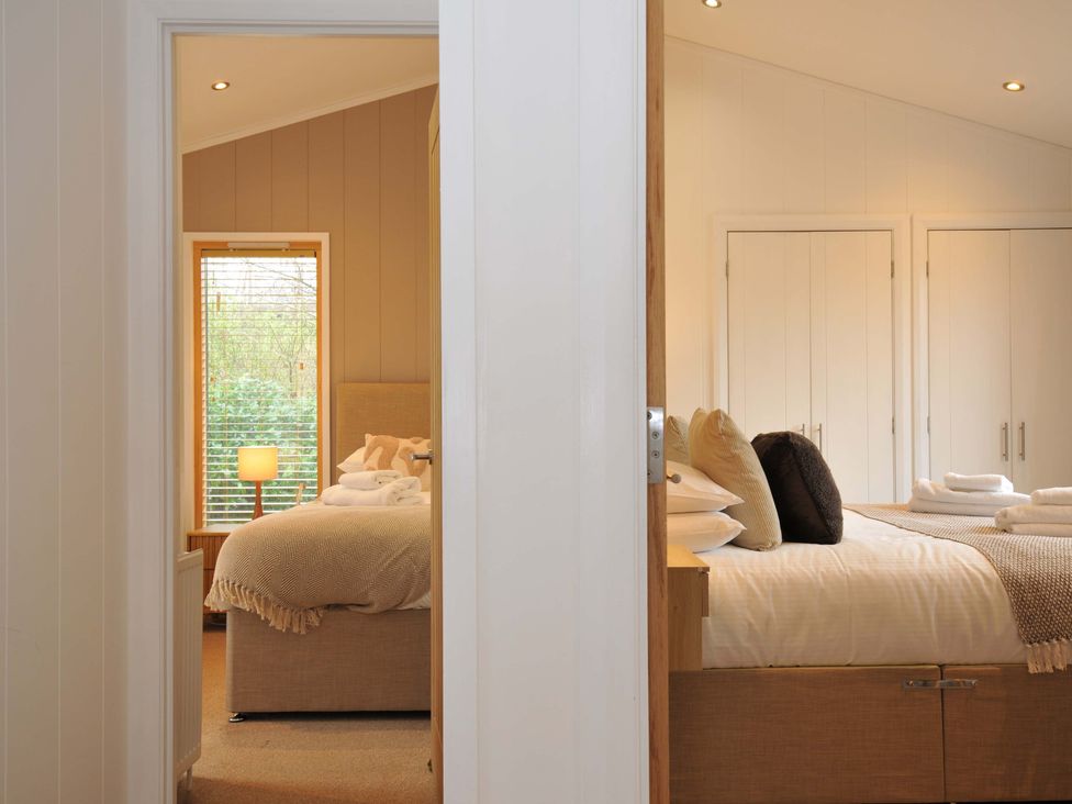 A bedroom with beds and a window at 4 Southern Place in Dobwalls