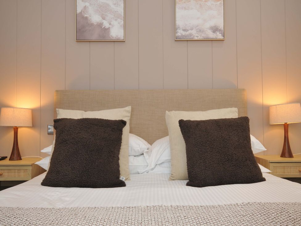 A bedroom with a bed and pillows at 4 Southern Place in Dobwalls