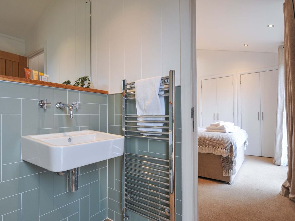 A bathroom with a sink and towel radiator at 4 Southern Place Dobwalls