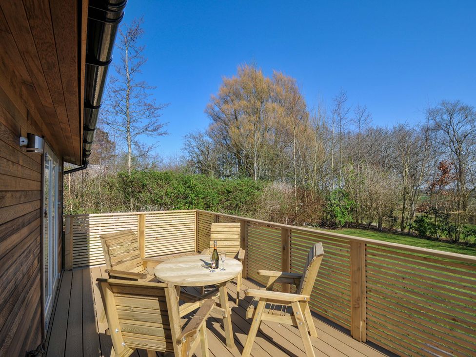 A deck with a table and chairs at 4 Southern Place in Dobwalls