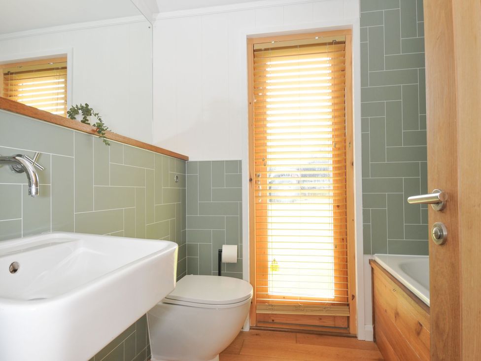 A bathroom with a sink and toilet at 4 Southern Place in Dobwalls