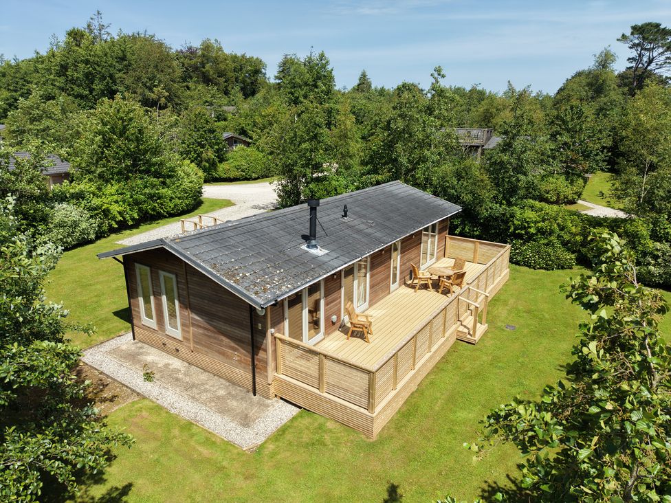 A house with a deck and seating area at 4 Southern Place in Dobwalls
