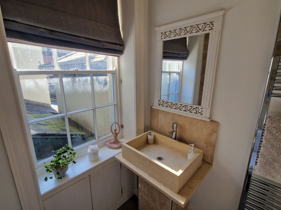 A bathroom featuring a sink and mirror at Flat 3 in Ross-on-Wye