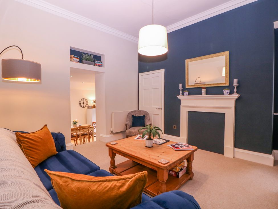 A living room with a coffee table and sofa at Stylish Town Apartment in Ross-On-Wye