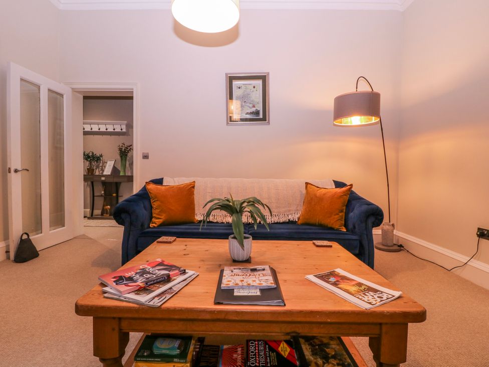 A living room with a sofa and a coffee table at Stylish Town Apartment in Ross-On-Wye