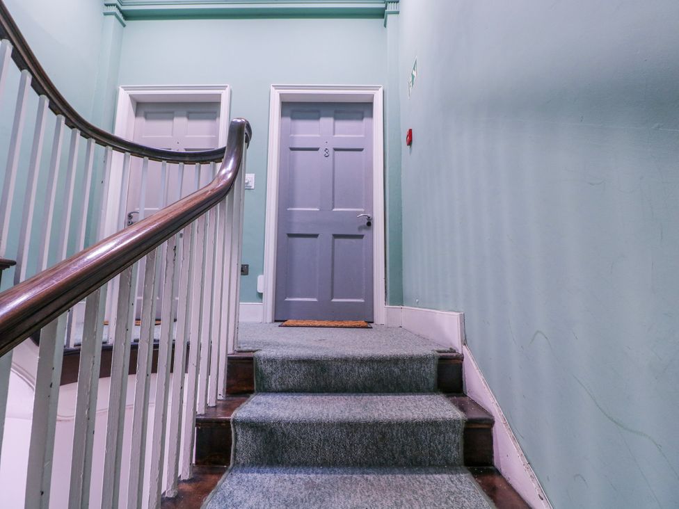 A staircase with doors on either side at Stylish Town Apartment in Ross-On-Wye