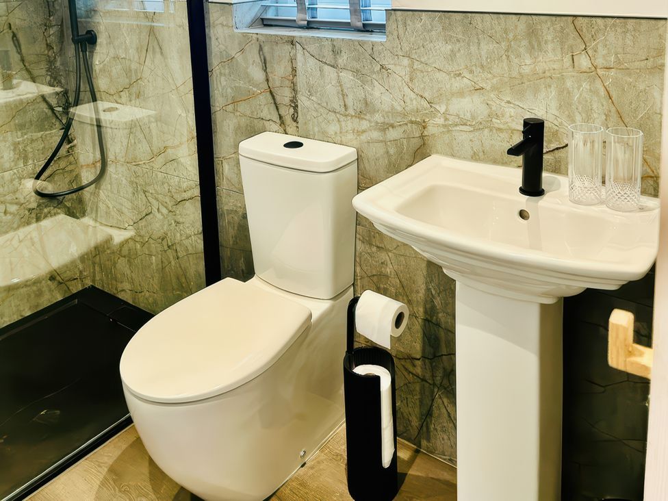 A bathroom with a sink and toilet at Little Acorn in Whitby