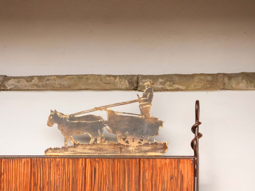 A metal sculpture of a man with cattle at Hawthorn Lodge in Whitby