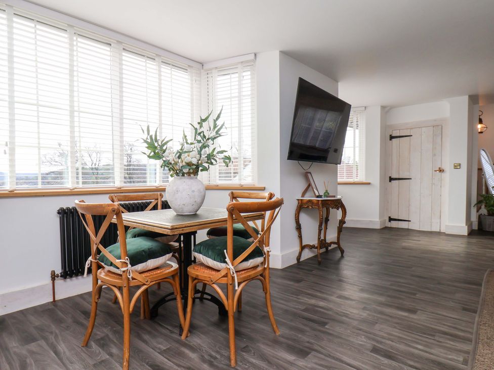 A dining room with a table and chairs at Hawthorn Lodge in Whitby