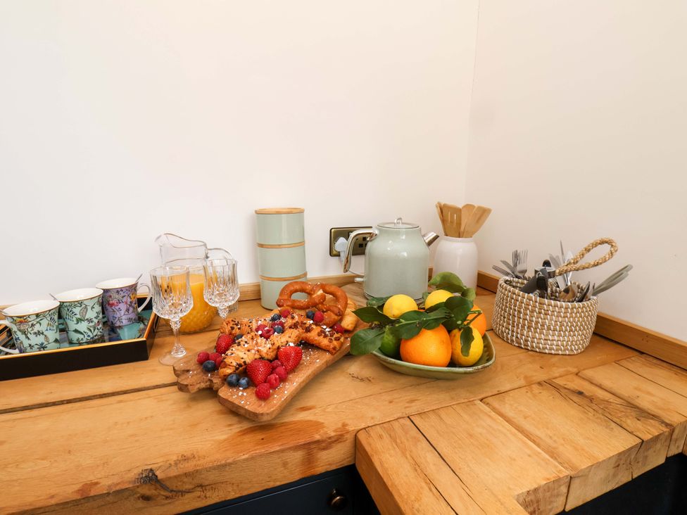 A kitchen counter with breakfast items and utensils at Hawthorn Lodge in Whitby
