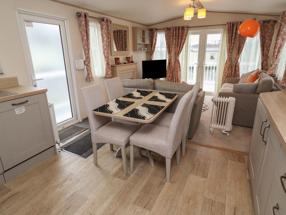 A dining room with a table and chairs at Cresswell Towers