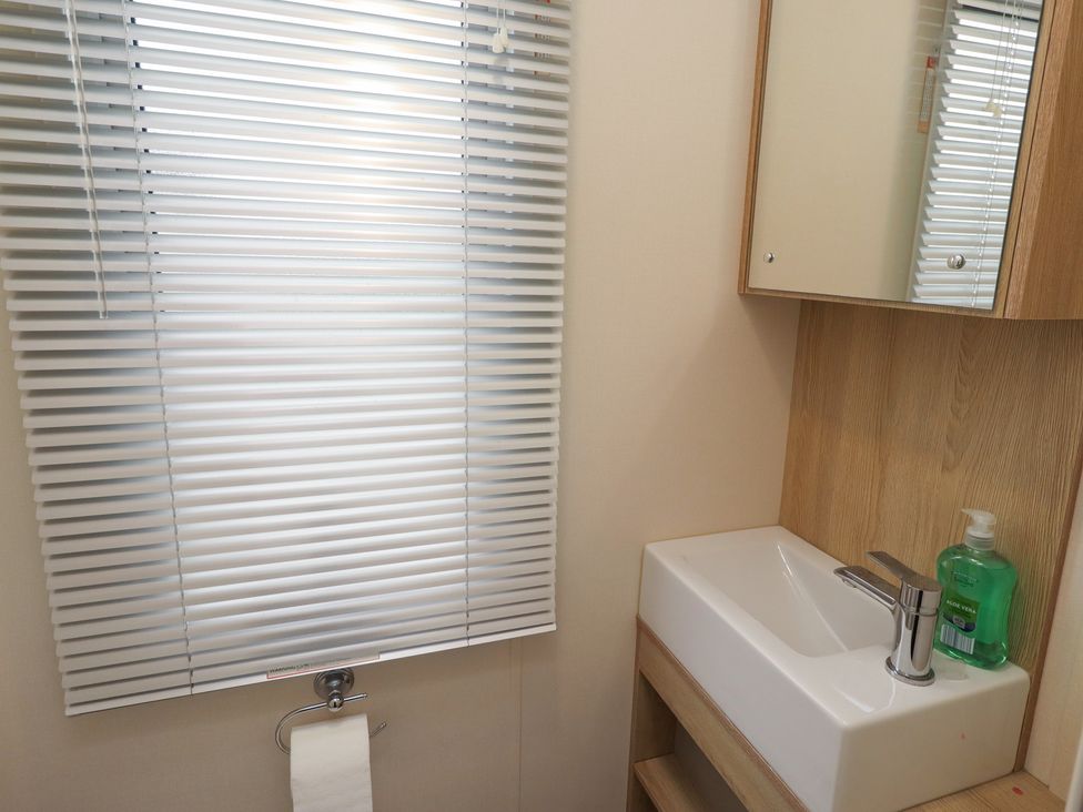 A bathroom with sink and towel holder at Cresswell Towers