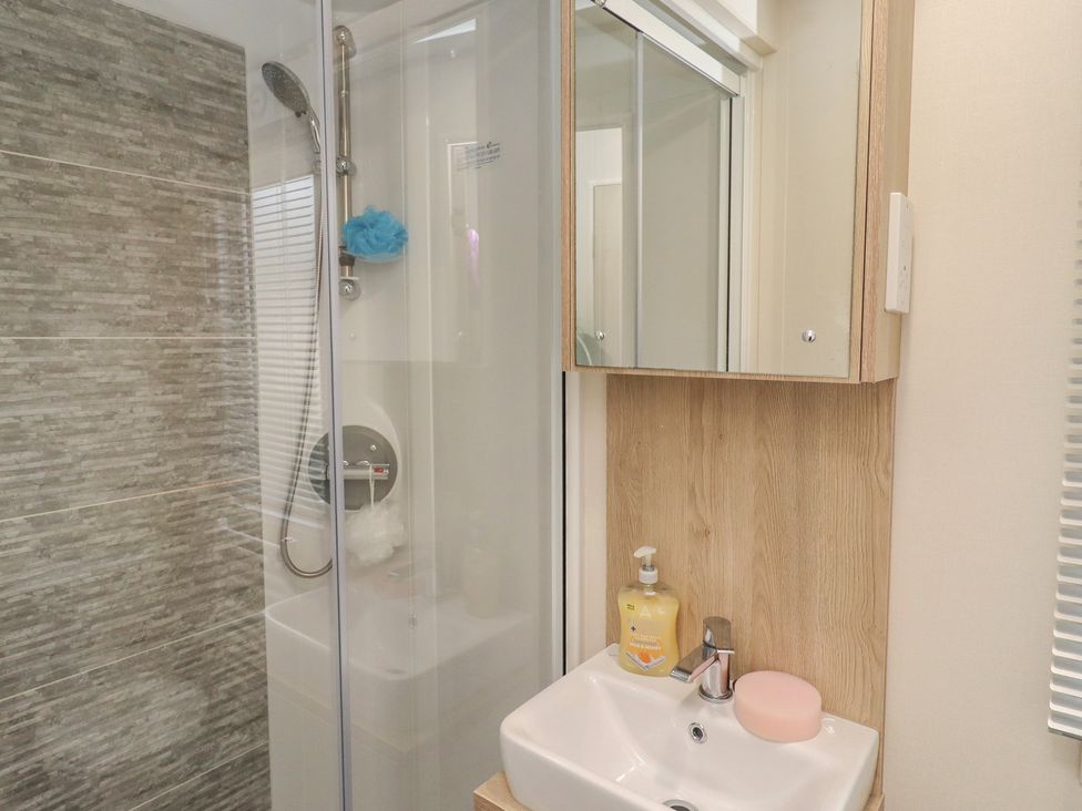 A bathroom with a shower and sink at Cresswell Towers