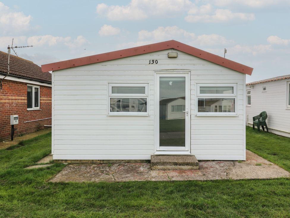 A cabin with a door and windows at 130 Park Ave Holiday Village