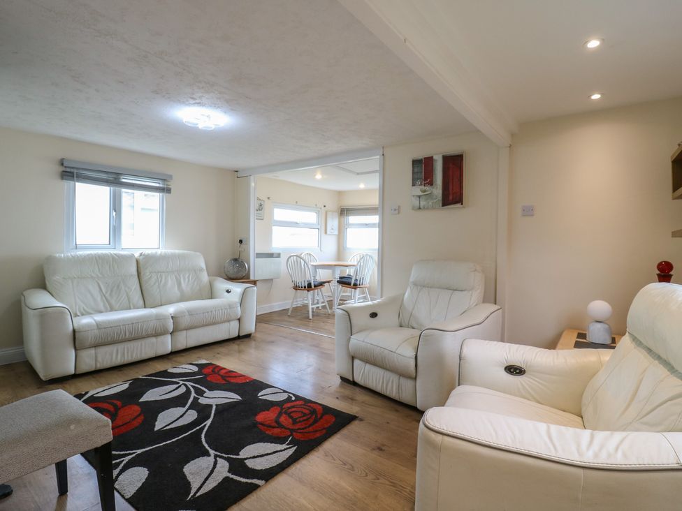 A living room with two sofas and a dining area at 130 Park Ave Holiday Village