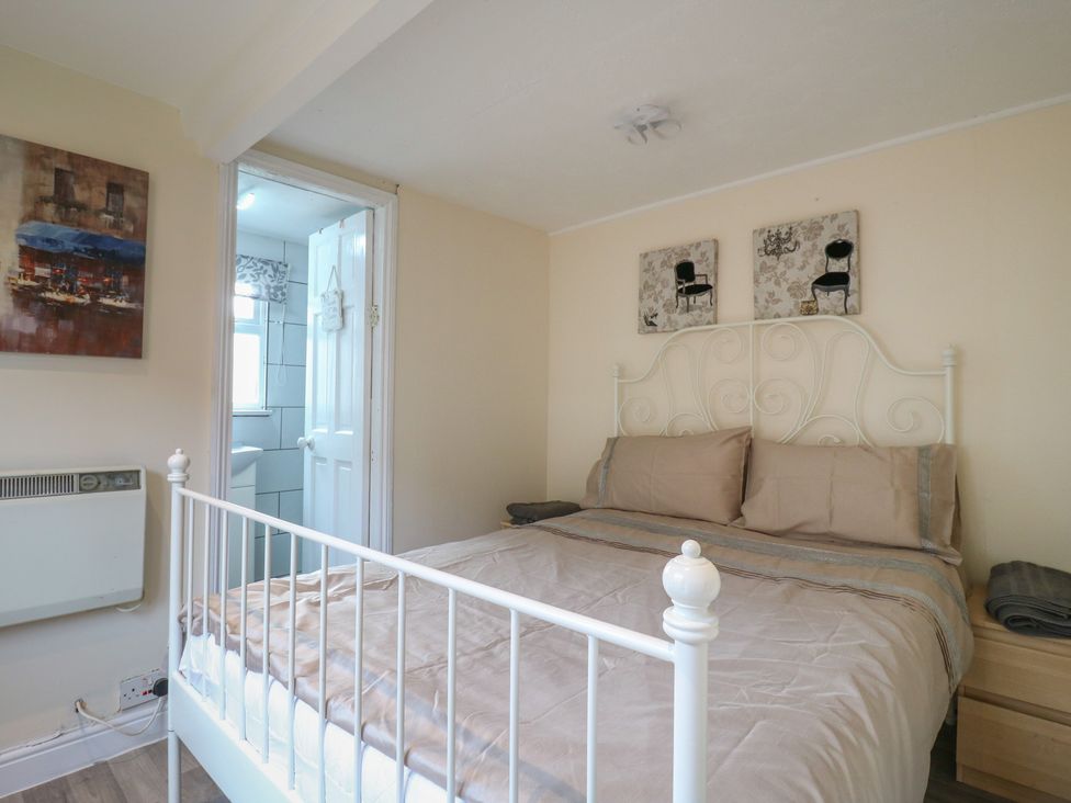 A bedroom with a bed and doorway leading to a bathroom at 130 Park Ave Holiday Village