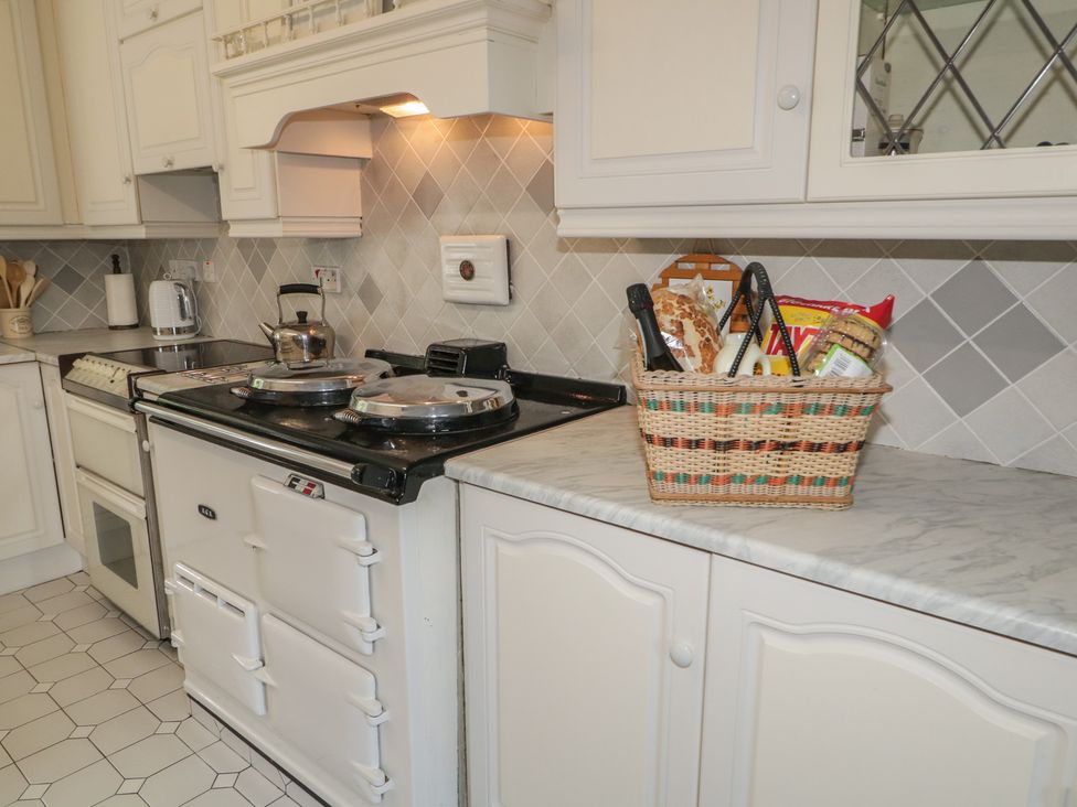 A kitchen with a countertop and cooking appliances at Riverdene in Mountjoy