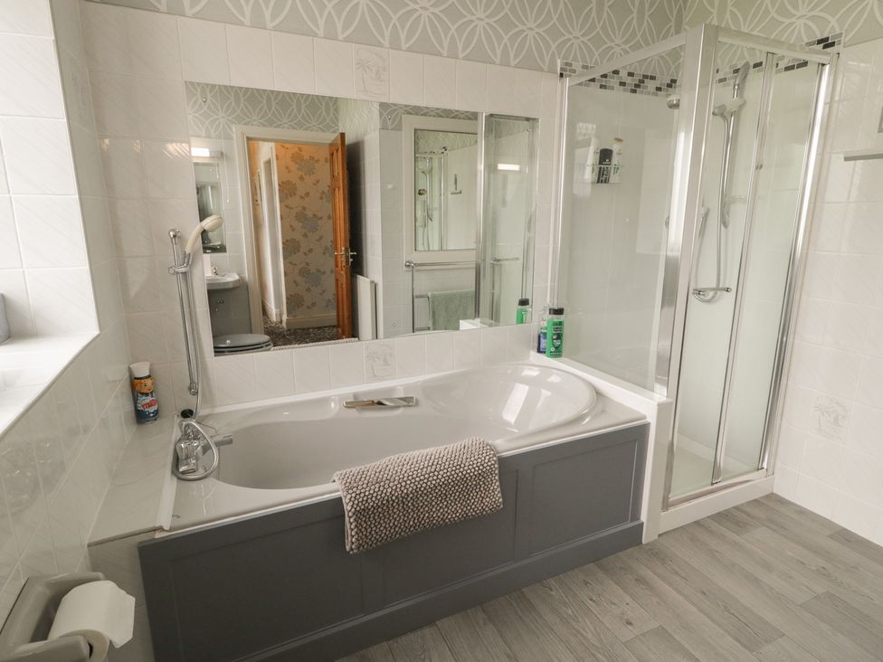 A bathroom with a bathtub and shower at Riverdene in Mountjoy