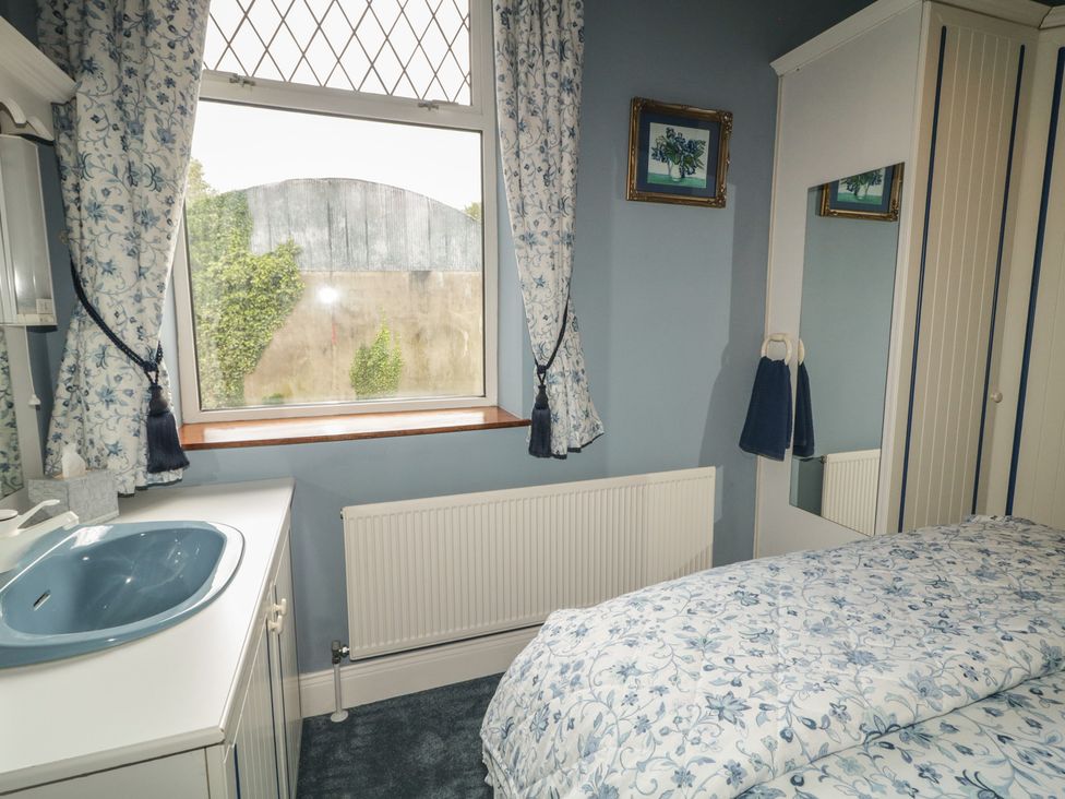 A bedroom with a bed and window at Riverdene in Mountjoy