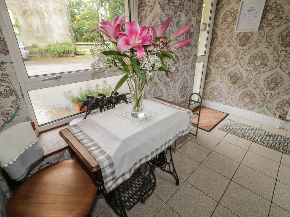 A table with flowers in a vase at Riverdene Mountjoy