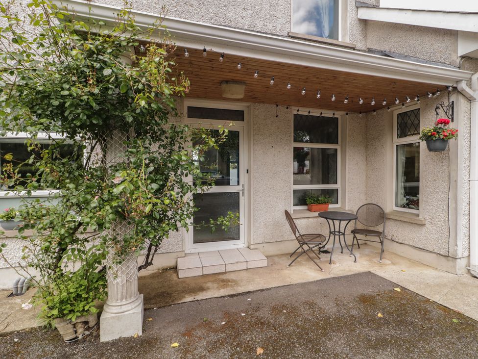An outdoor area with a table and chairs at Riverdene, Mountjoy