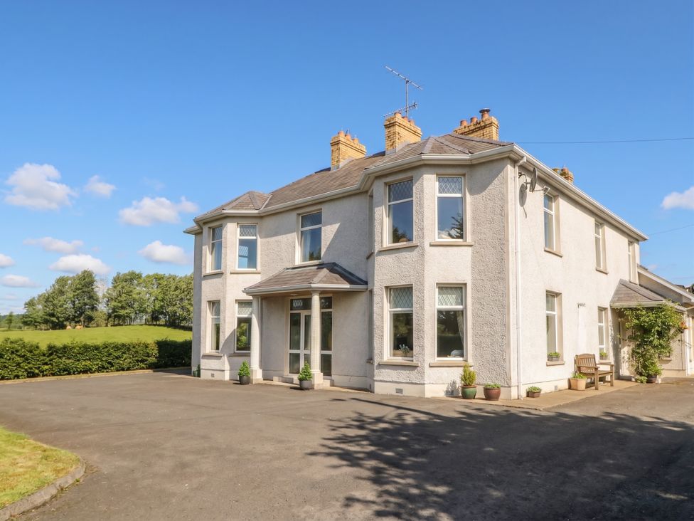 A house with a driveway and garden at Riverdene in Mountjoy