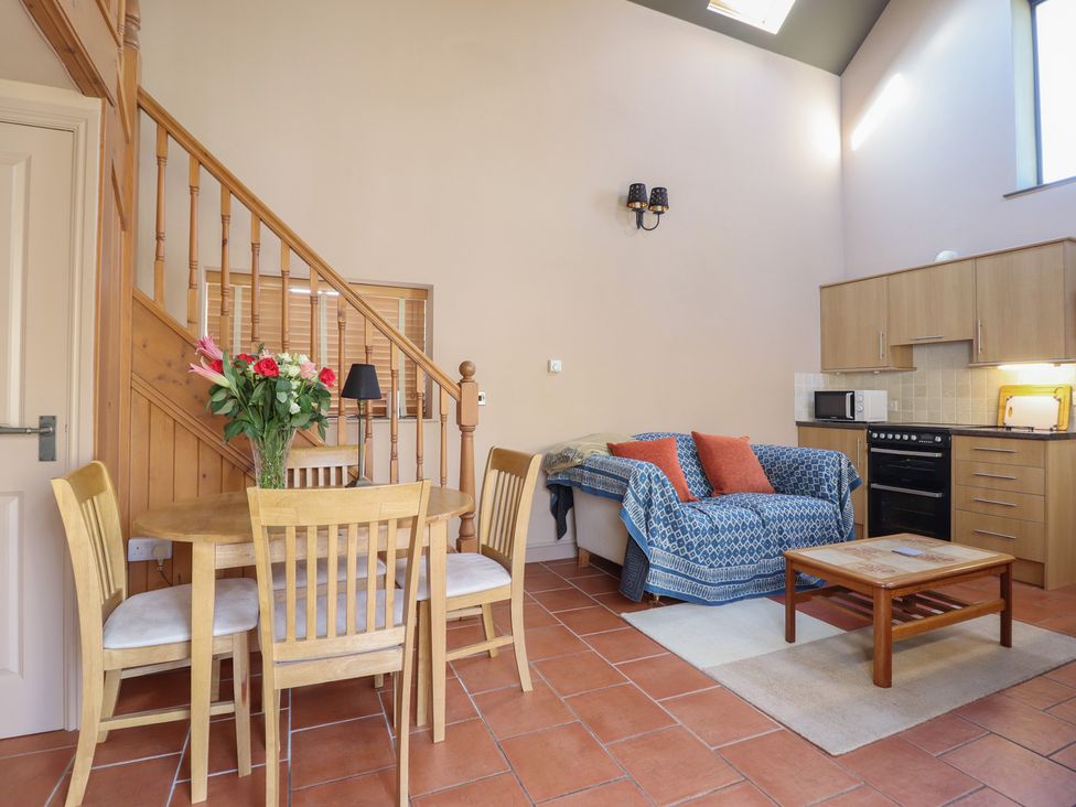 A living room with table and chairs at Ystwyth Cottage in Newtown