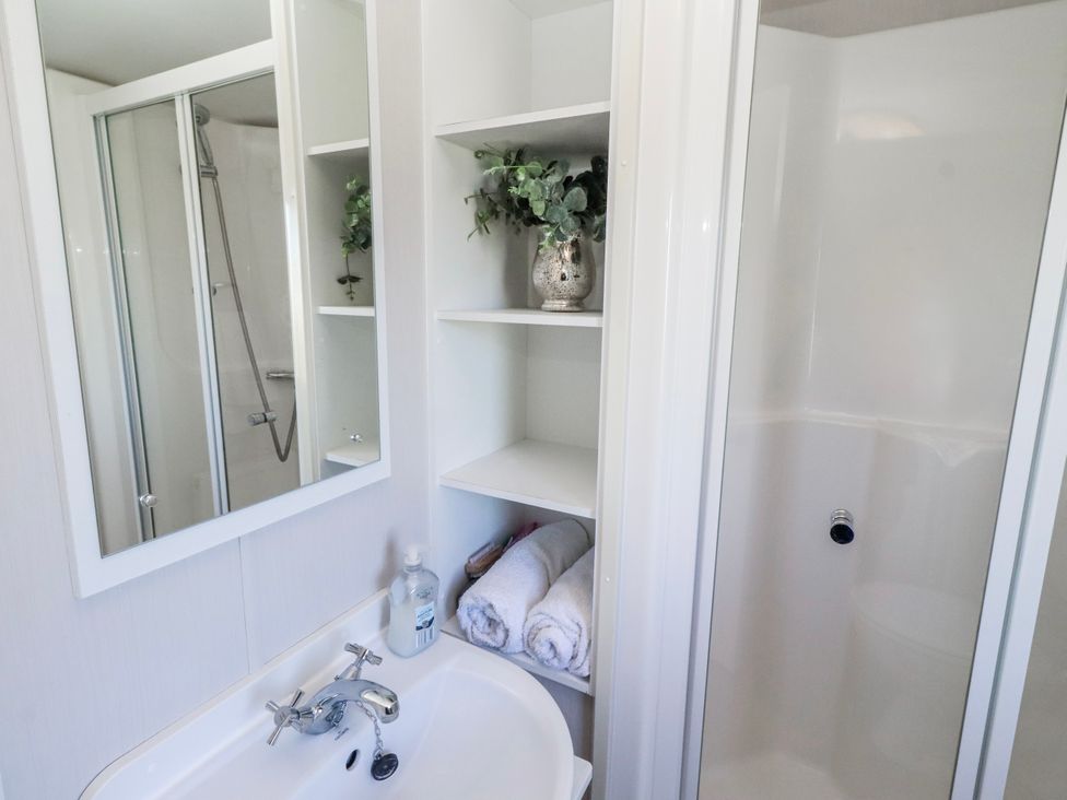 A bathroom with a sink and shower at 75 Morpeth Mews Wooler