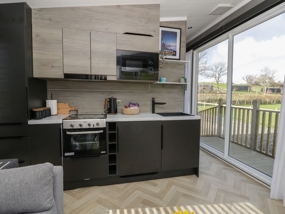 A kitchen with an oven and sink in Dawn's Rest Nantmel near Rhayader