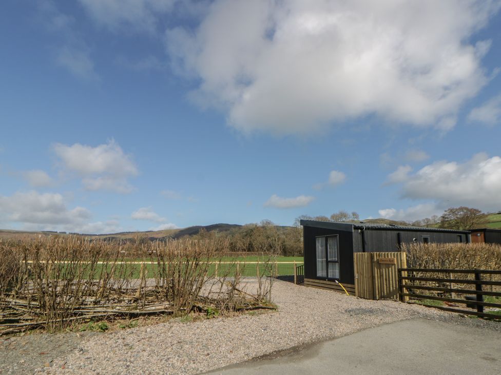 A building next to a field at Dawn's Rest in Nantmel near Rhayader